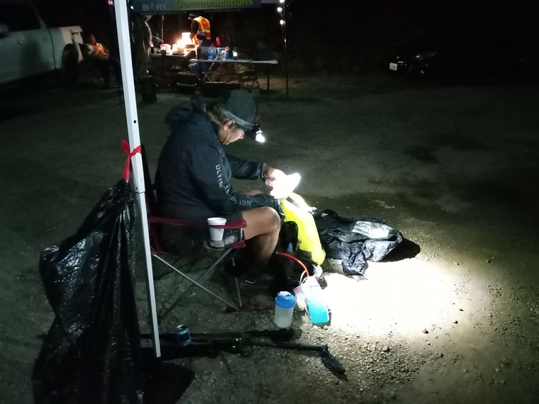 click to enlarge - photo by: Brandon Moore - Late night prep - what do I need from my drop bag? Temple Fork aid station.