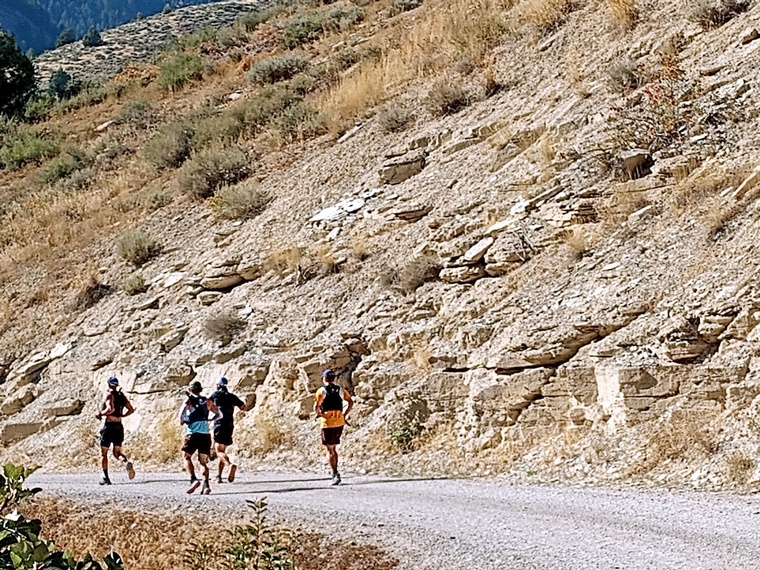 click to enlarge - photo by: Brandon Moore - Not everything is pretty and green. Group of boys heading towards the Temple Fork aid station. It's great to have a buddy!