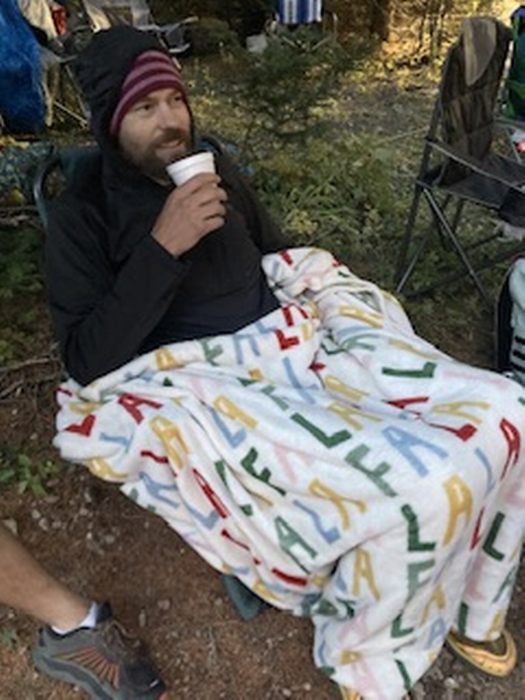 click to enlarge - photo by: Bear 100 Runner Support - This is a nice smile, but he was actually so miserable. We got a lot of liquids and calories into him though. We had a lot of wonderful friends encouraging him and offering hope. But he felt truly terrible.