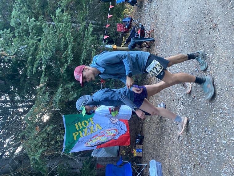 click to enlarge - photo by: Bear 100 Runner Support - Heading for some fresh aid station made pizza at the mile 51 aid. Every mile from this point on is a new pr! Looked GREAT. Amazing.